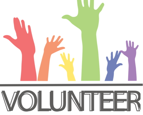 Hands in the air with word Volunteer